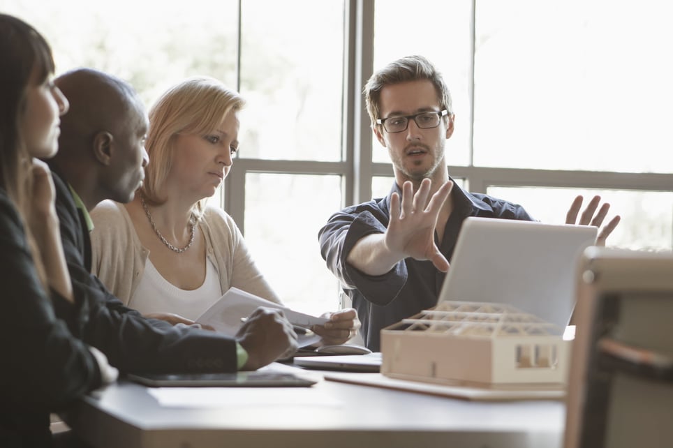 man-explaining-something-with-his-hands-how-to-be-more-persuasive